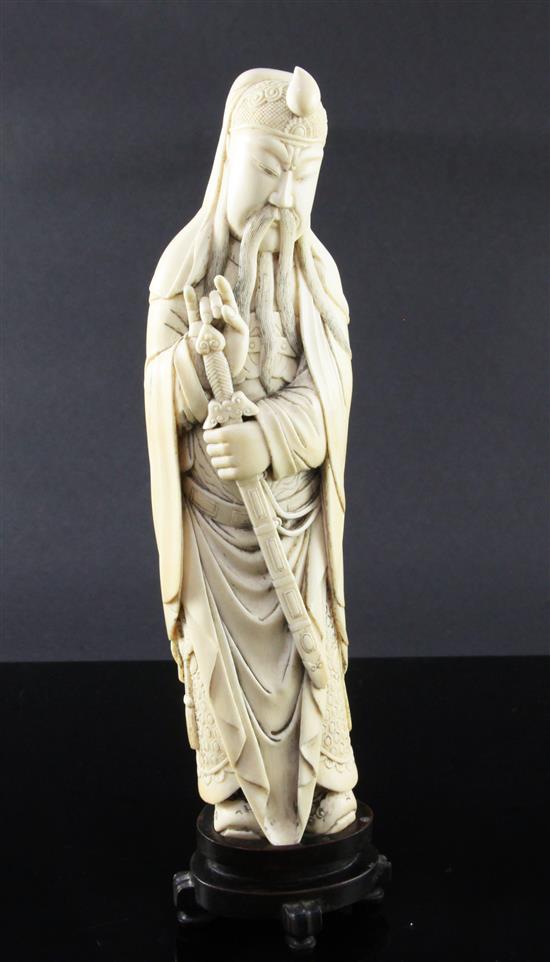 A Chinese ivory tusk figure of Lu Dongbin, late 19th / early 20th century, total height 30.5cm